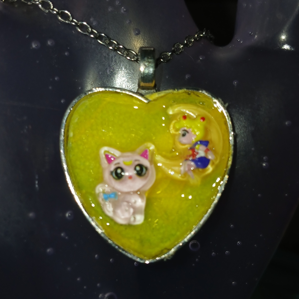 Heart-Shaped Pendant with Cat and Character